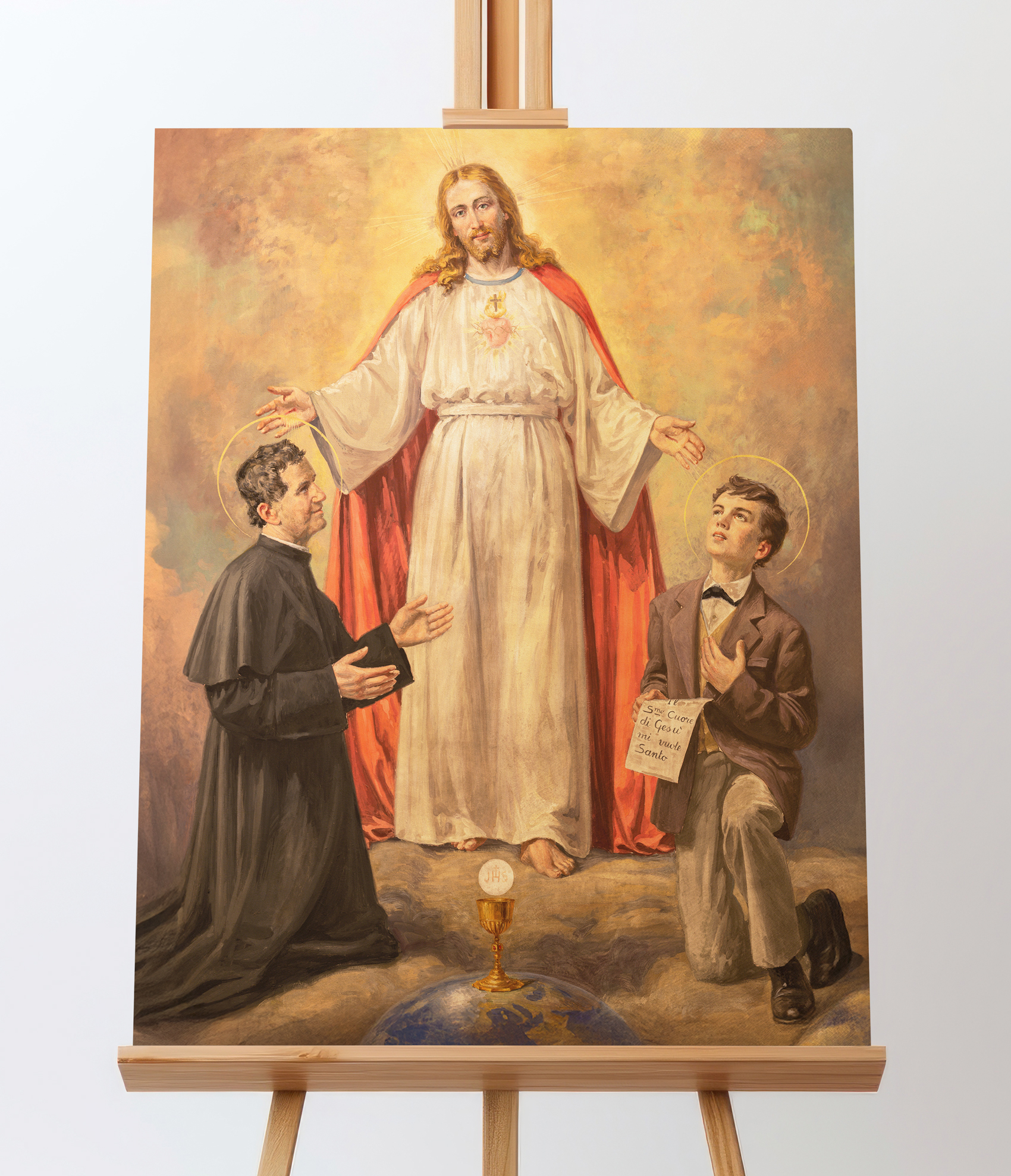 Obraz na płótnie z Jezusem i Świętymi Dominikiem Savio oraz Janem Bosko.